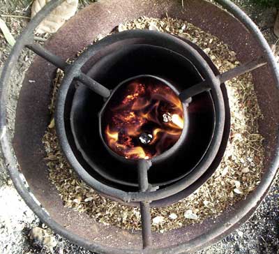 An above view showing the clean combustion of the new Mayon Turbo Rice Hull cooker